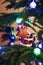 House, balls, stars and lighting garland on Christmas tree