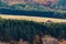 House with big farmland on a forest hill in autumn with vivid colors and sharp detail in Bulgaria, Eastern Europe