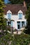 House with blue shutters in the picturesque village of Chedigny in the Loire Valley, central France.