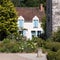 House with blue shutters in the picturesque village of Chedigny in the Loire Valley, central France.