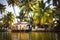 House-boat pleasure cruise ship in India  Kerala on the seaweed-covered river channels of Allapuzha in India. Boat on the lake in