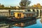 House boat, reflection, moored to a dock at chateau Isenbourg, Alsace, France