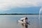 A House boat or Shikara boat ride on Dal lake Srinagar, Jammu and Kashmir, India. The Great Himalayas range are visible at a