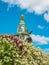 House of the Book on Nevsky Prospect in Saint Petersburg against the backdrop of blooming lilacs in summer