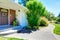 House with brick wall trim. View of entrance porch and walkway