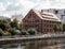 House in Bydgoszcz. Ancient building above the canal. Red brick building. Architecture. Architecture in the Polish city