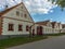 House captured inside village with beautiful sky behind