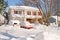 House and cars after snowstorm