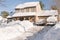 House and cars after snowstorm