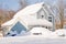 House and cars after snowstorm