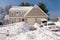 House and cars after snowstorm