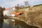 House and castle above a river