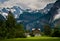 House close to a Steep Rocky Mountain