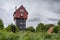 House in the Clouds above greenery