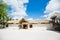 House in colonial style with roof of palm leaves