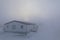 House almost completely gone under blizzard conditions in the Canadian Arctic