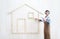 House construction renovation concept handyman carpenter worker man with meter  measure and show the model of a wooden house,
