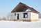 House construction in winter. Unfinished home roofing metal tiles construction. Roofing Construction in Winter. Winter Home Build
