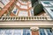 House in Copenhagen. Brick wall, balcony with columns, windows. Details