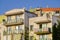 House with the Creeper on the wall. stains on the plaster from the rain, old house. many plants on the balconies. city gardening