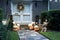 The house is decorated for Halloween:On the steps of a pumpkin and a skeleton, on the door is an autumn wreath. Evening, Houston,