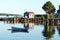 House, dock, row boat and lobster traps reflecting in the water