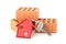 House door key with red house key chain pendant and bricks