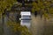 A house for ducks reflected in the water to Clean ponds, autumn, Moscow, Russia