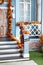 House entrance staircase decorated for autumn holidays, fall flowers and pumpkins