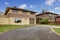 House exterior Backyard with driveway and garage.