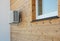 House exterior knotty pine, ceder wood wall siding and panel with air conditioner outdoor unit and window