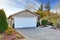 House exterior. View of garage and driveway