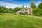 House exterior. View of landscape on front yard