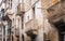 House facade with colorful, ancient and funny balcony on Republic Street in Valletta, Malta