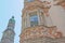 A house facade decorated with carvings and located in the historic center on street Herzog Friedrich Strasse, with the Stadtturm C