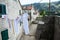 House facade wall with laundry drying outdoor in Kotor downtown, Montenegro, Europe