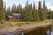 House in forest by river