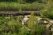 House with the garden near railway lines. wooden house in the forest aerial. rural landscape