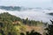 House in green and foggy Tuscany hillside