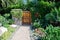 House with green lawn manicured frontyard garden in suburban residential neighborhood