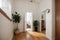 House hallway entrance interior with stairs and furniture. Apartment background with door, mirror, bag on hanger, flower in vase,