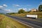 House of highway in a rural landscape, truck on the road