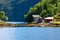 House and huts on the shore of Bergen fjord.