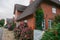 house with hydrangeas.Large bushes of hydrangeas near a red brick house. Landscape design.Architecture and plants of the