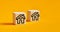 House icons on wooden cubes with buy or rent options. Decision of renting a real estate