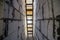 House interior under construction and renovation. Perspective view of wooden ladder, future staircase in long corridor passage