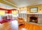 House interior.Yellow living room and contrast red dining area