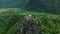 A house on a karst peak above the rice fields and on the edge of the mountains