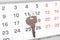 A house key on a calendar background