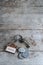 House key with home keyring with coin pile on rusty wood background